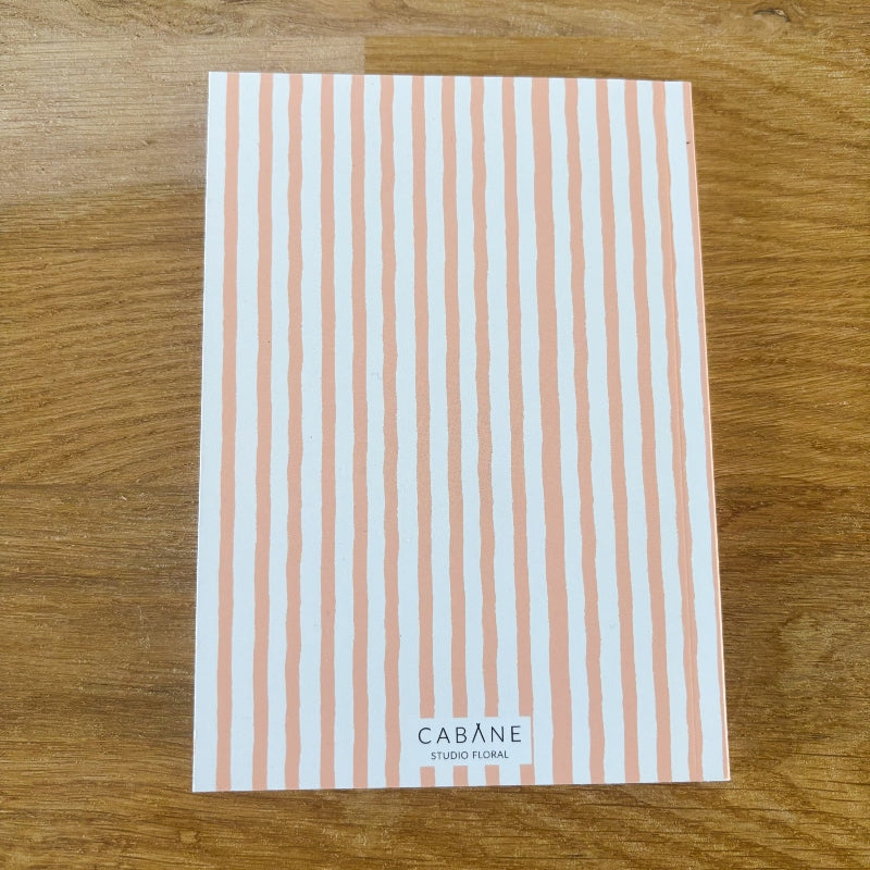 dos du carnet floral alma par cabane studio floral avec rayures style aquarelle